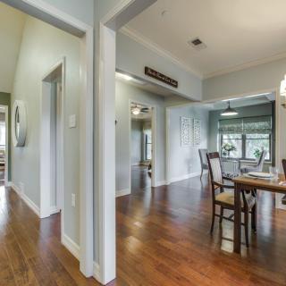 A modern dining area with hardwood floors and an open layout.