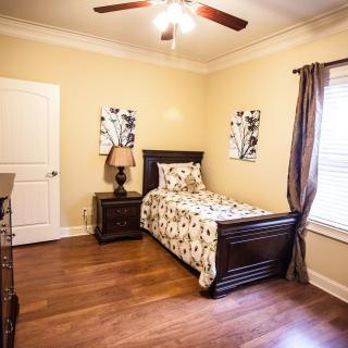 Cozy bedroom with a single bed and elegant decor.