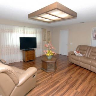 A cozy living room with comfortable seating and modern decor.