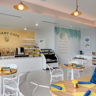 A modern cafe interior with stylish decor and seating arrangements.