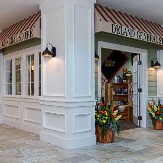 Charming storefront with a welcoming entrance and decorative plants.
