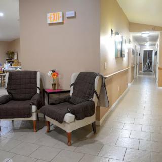 A cozy hallway with comfortable seating and soft lighting.