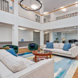 A spacious, modern living room featuring comfortable sofas and a stylish coffee table.