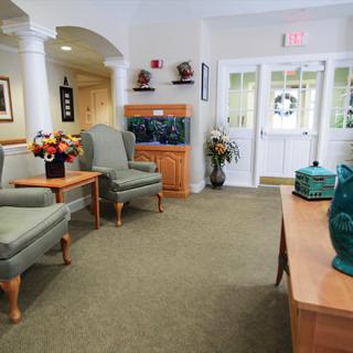A well-decorated waiting room with comfortable seating and elegant decor.