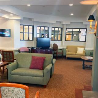 A cozy living room with comfortable seating and a television.