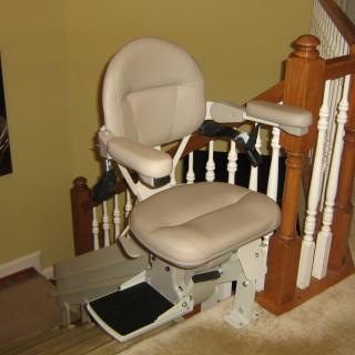 A stairlift installed along a staircase for mobility assistance.