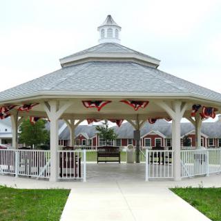 A charming gazebo in a park setting, perfect for relaxation and gatherings.
