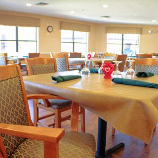 A well-arranged dining area with tables set up for a meal.