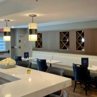A modern and stylish dining area with sleek seating and contemporary lighting.
