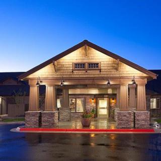 A well-lit hotel entrance at night.