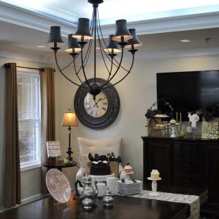 A cozy living room with a stylish chandelier and tasteful decor.