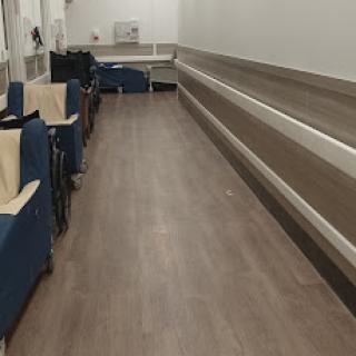 A spacious waiting area featuring comfortable chairs and a clean, modern design.