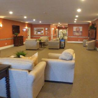 Spacious lobby with comfortable seating and warm lighting.