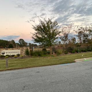 Entrance to a residential neighborhood at sunset.