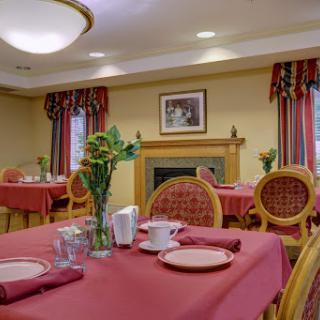 A cozy dining area with elegant table settings and a welcoming ambiance.