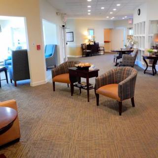 A spacious lobby with comfortable seating areas and soft lighting.