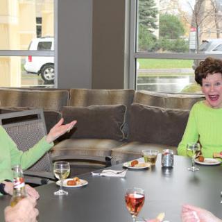 A joyful moment shared among friends during a casual gathering.