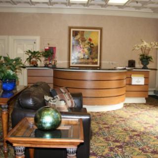 A welcoming office lobby with a reception desk and comfortable seating.