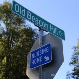Street signs indicating Old Beacon Hill Drive and a nursing home nearby.