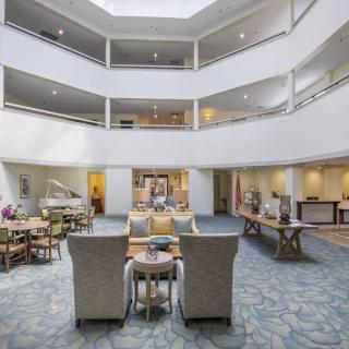 A modern lobby with comfortable seating and an open atrium design.