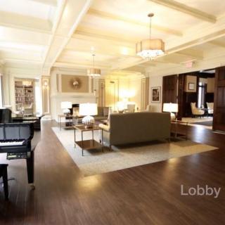 A spacious and elegantly designed lobby with comfortable seating and warm lighting.