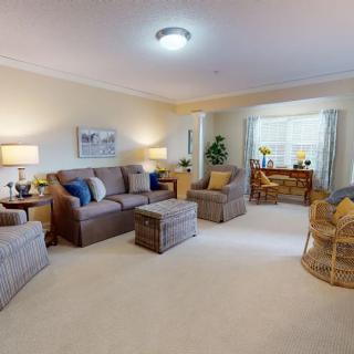 A cozy living room with comfortable seating and natural light.