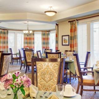 An elegant dining room with stylish decor and neatly arranged tables.