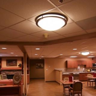 A cozy kitchen and dining area with warm lighting.