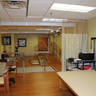A physical therapy and rehabilitation center featuring exercise equipment and treatment areas.