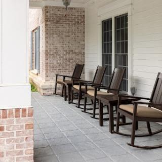 A peaceful porch featuring rocking chairs, perfect for relaxation.