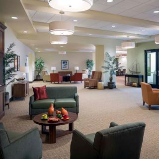 A modern, well-lit lobby with comfortable seating and contemporary decor.