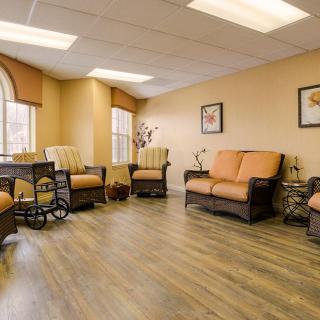 A cozy waiting room with comfortable seating and bright lighting.