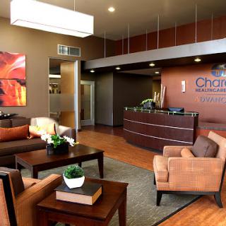 A stylish and inviting reception area featuring modern furniture and contemporary artwork.