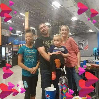 A joyful moment shared with family at a fun indoor venue.