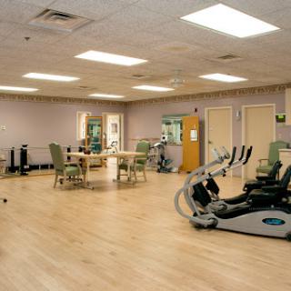 A spacious gym area equipped for rehabilitation and fitness activities.