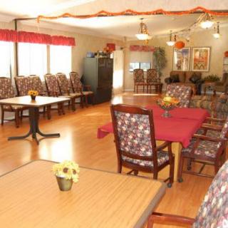 A well-decorated dining room with tables and chairs arranged for a communal setting.