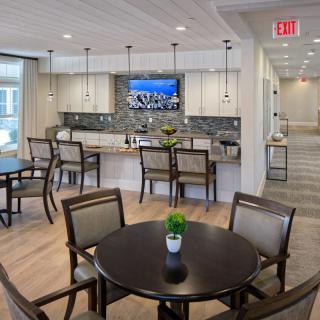 A modern kitchen and dining area featuring contemporary furnishings and decor.