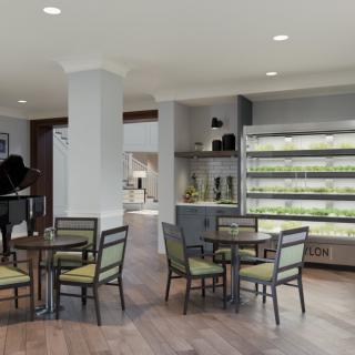 A modern cafe with indoor seating and a vertical plant display.