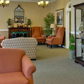 A cozy living room with comfortable seating and elegant decor.