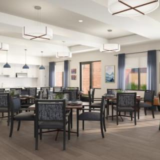 A modern dining room with elegant furnishings and ample natural light.