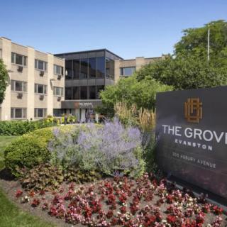 The Grove, a well-landscaped building with prominent signage and modern architecture.