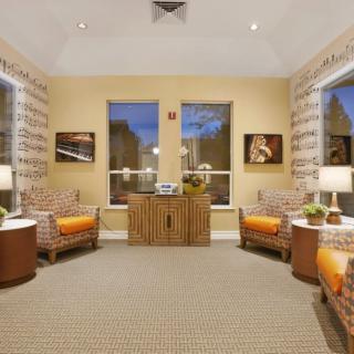 A cozy living room with wicker furniture and warm lighting.