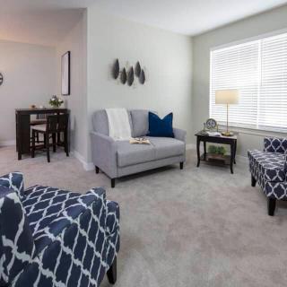 A modern living room with comfortable seating and stylish decor.