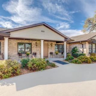 A well-maintained house exterior with landscaped garden.