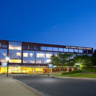 A modern building illuminated at night, showcasing contemporary architectural design.