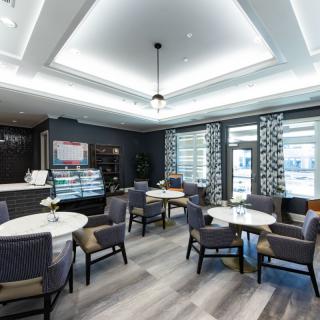 A modern cafe interior with elegant seating and stylish lighting.