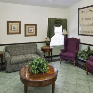 A cozy living room with traditional furniture and decor.