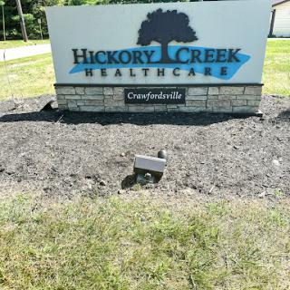 The entrance sign for Hickory Creek Healthcare in Crawfordsville.