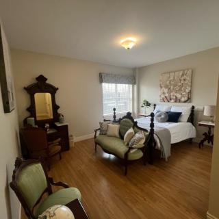 A cozy bedroom with antique furnishings and elegant decor.
