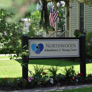 Northwood Childcare & Nursing Center sign amidst a well-maintained landscape.